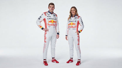Man and woman in white Red Bull Honda racing suits, studio photo